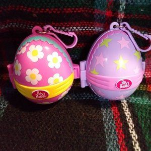 2 Polly Pocket Easter eggs pink & purple 1 character and 1 Easter basket EUC